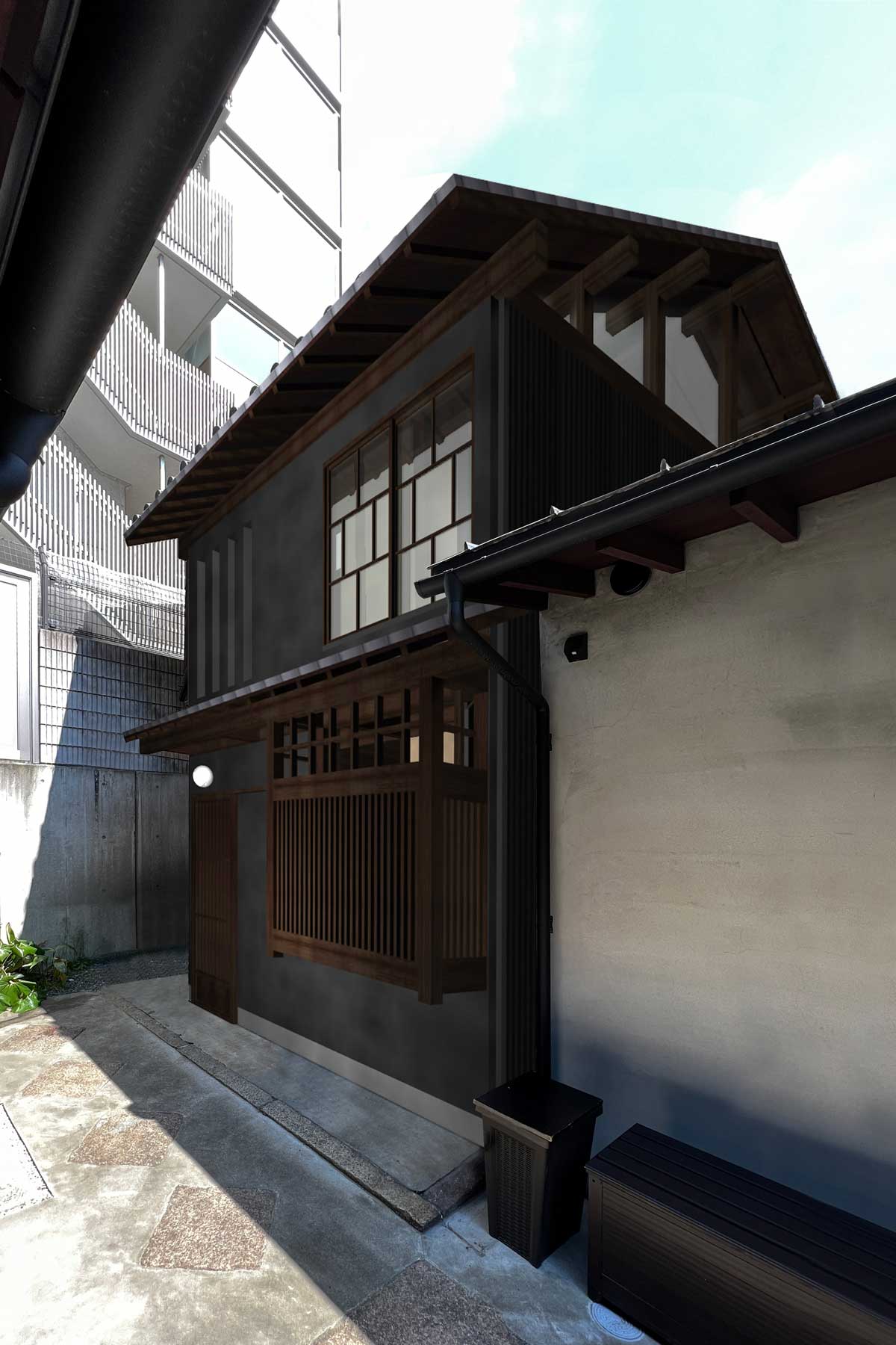 改修後の外観。木格子・おたふく窓・虫籠窓・黒漆喰など、向かいの既存棟の意匠を踏襲して統一感のある路地を形成。